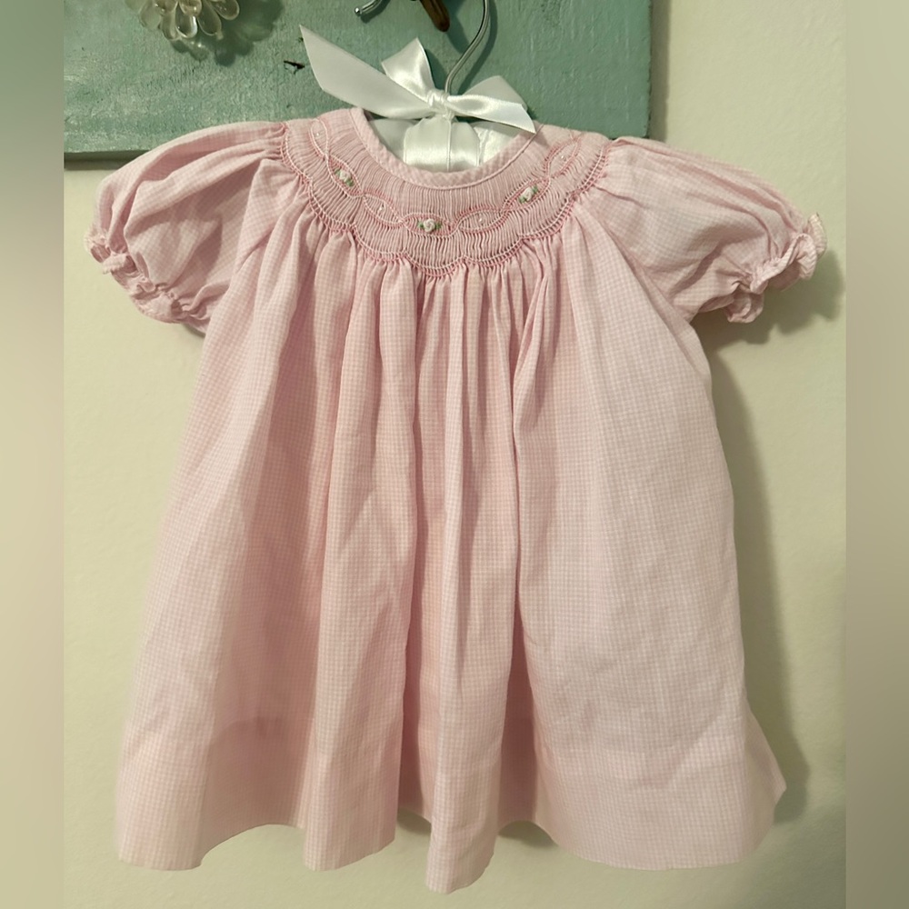 Beautiful pink Petit Ami smocked newborn dress